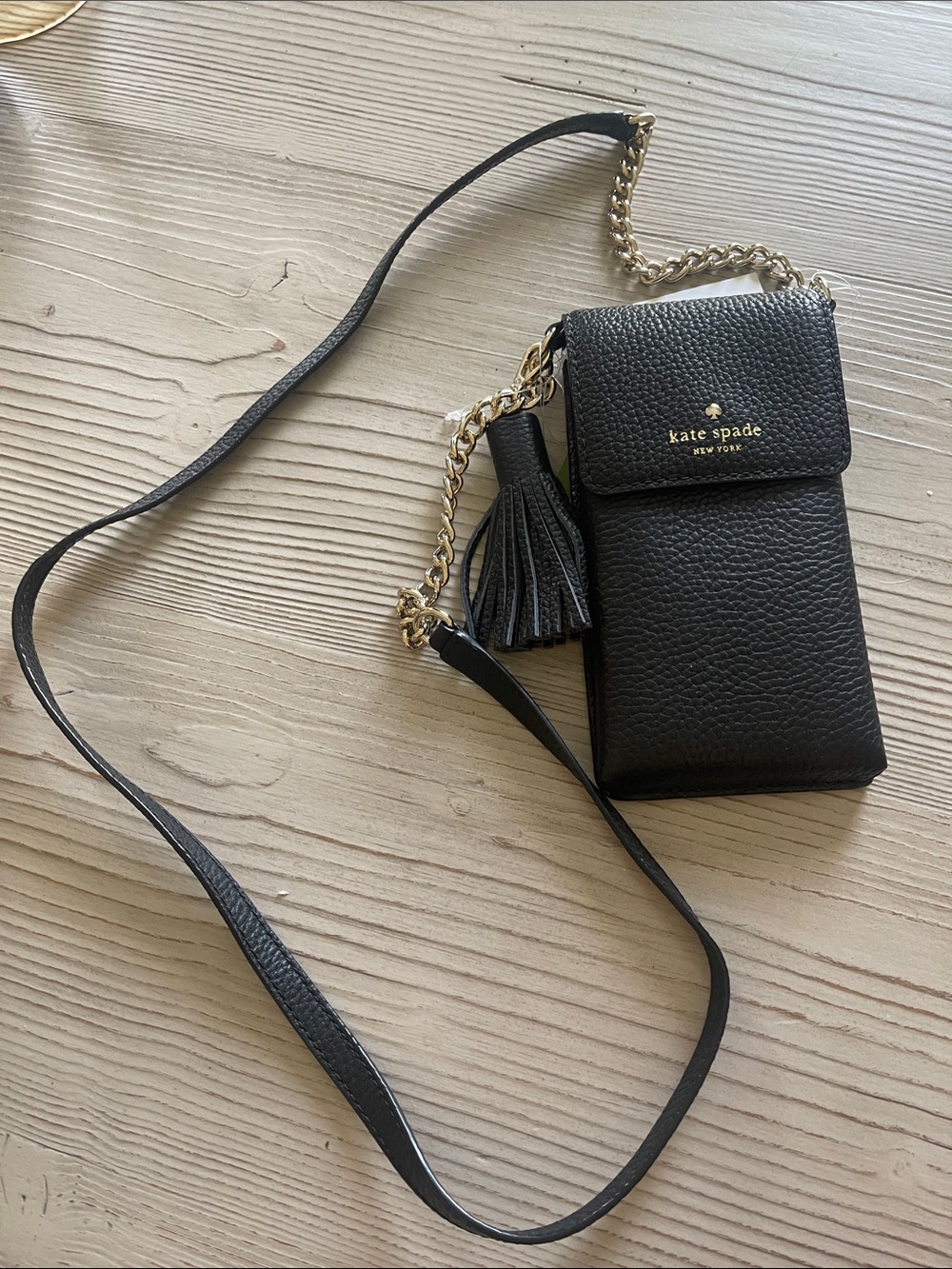 kate spade black pebbled leather crossbody phone bag with tassel and chain